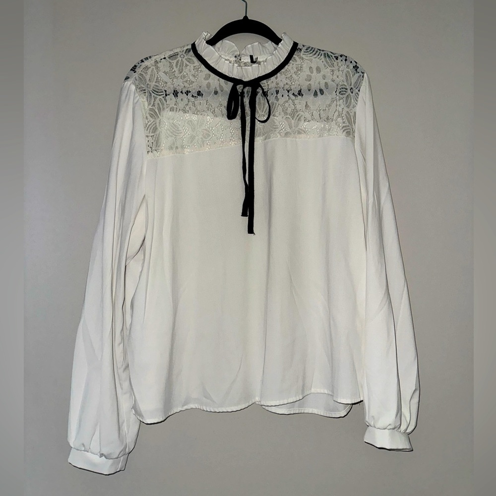 White long sleeve blouse; lace top with ruffle collar and black neck tie